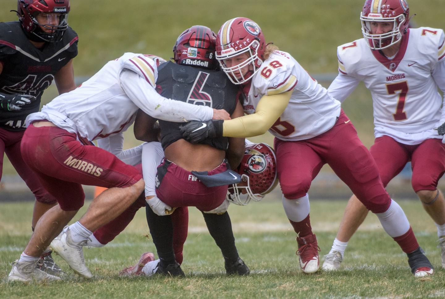 The Morris defense brings down Peoria High running back Malachi Washington in the first half of their Class 5A football state semifinal Saturday, Nov. 19, 2022 at Peoria Stadium.