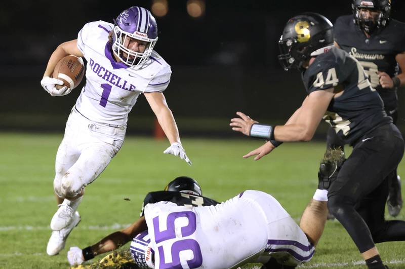 Rochelle's Grant Gensler looks to get outside of Sycamore's Cooper Bode during their game Friday, Sept. 22, 2023, at Sycamore High School.