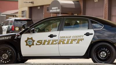 Woman hospitalized after DeKalb car crash