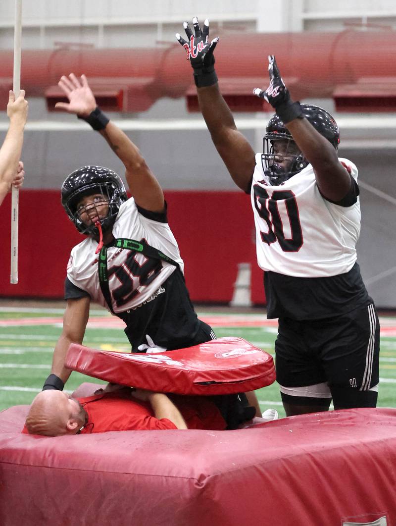 Northern Illinois University defensive end Nevaeh Sanders (left) and defensive tackle  	Reggie Jean work through a special teams drill Wednesday, July 31, 2024, at practice in the Chessick Practice Center at NIU.