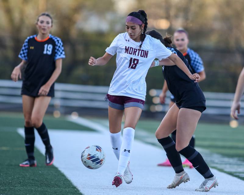 Morton's Brigitte Solano (18) handles the ball on the sidelines during soccer match between Morton at Willowbrook.  April 15, 2024.