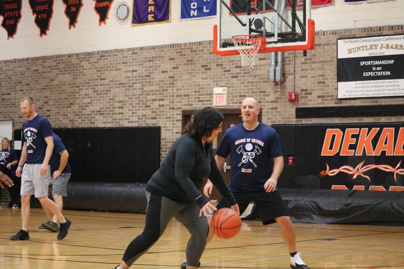 Dori De La Cruz takes to the court dribbling Monday, Dec. 5, 2022 in the Toys for Tots community basketball game.