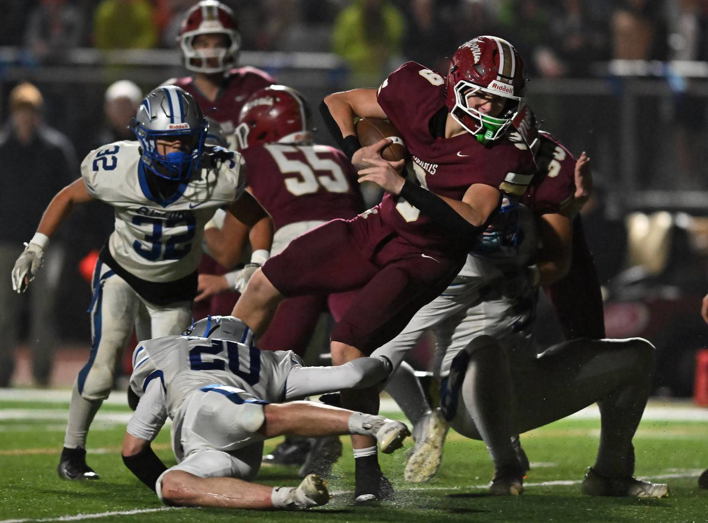 Morris' Caeden Curran (9) goes airborne for a big gain during the class 4A first round playoff game against Woodstock on Friday, OCT. 31, 2025, at Morris.