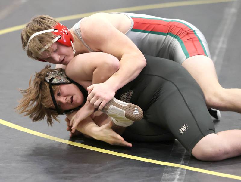 LaSalle Peru’s Brett Aimone works to pin Sycamore’s Nick Cvek in the 195 pound match Thursday, Dec. 1, 2022, during the meet at Sycamore High School.