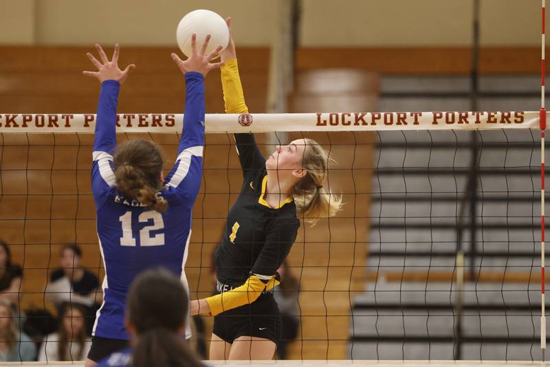 Joliet West’s Ava Grevengoed stretches for the kill against Sandburg in the in the Class 4A Lockport Sectional title match on Wednesday.