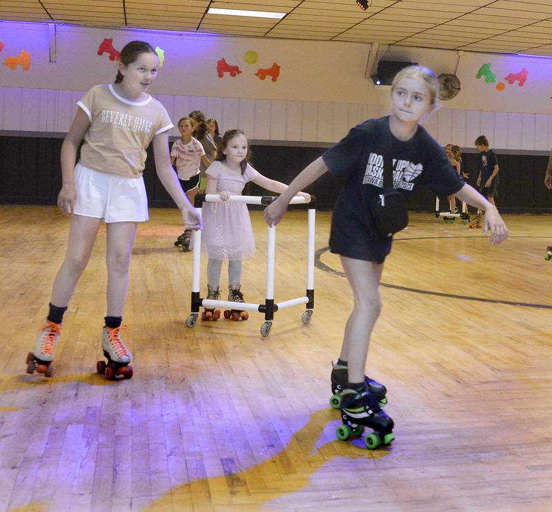 Skaters of various skill levels make their way around the rink Wednesday, June 28, 2023, at the Paramount in Ottawa during the Ottawa Recreation All Parks Skating Party.