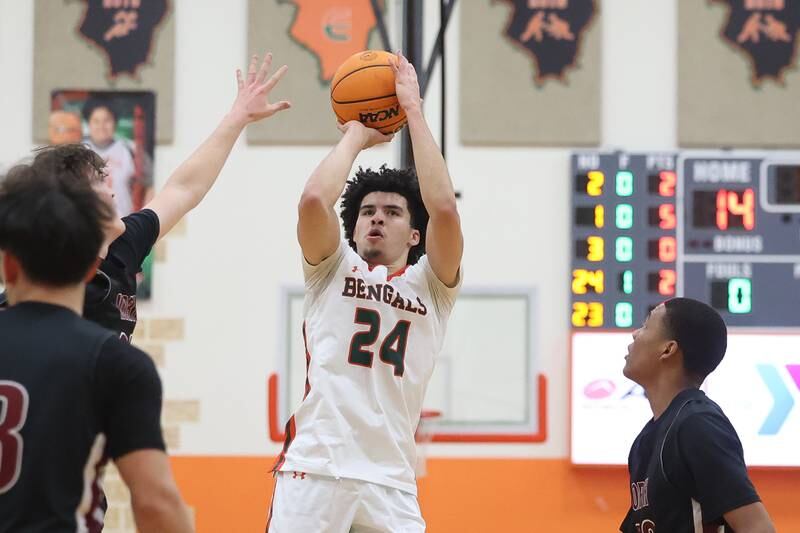 Plainfield East’s Kobe Jordan takes a midrange shot against Plainfield North on Tuesday, Jan 14, 2025.