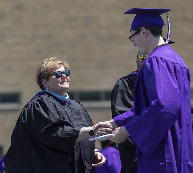 Retiring Dixon Schools Superintendent Margo Empen hands out a diploma to Blake Ackerman on Sunday, May 24, 2026, at Dixon High School’s graduation.
