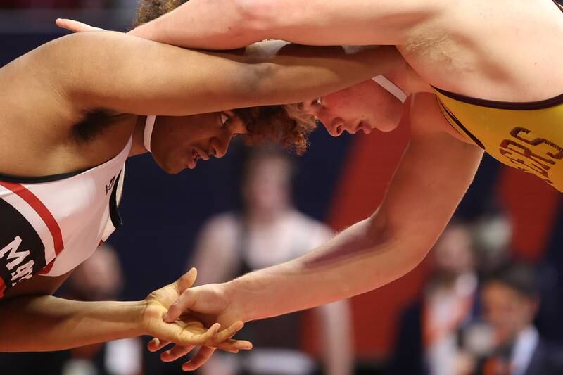 Lockport’s Andrew Blackburn-Forst works against Marist’s Ghee Rachal in the Class 3A 220lb. championship match at State Farm Center in Champaign. Saturday, Feb. 19, 2022, in Champaign.