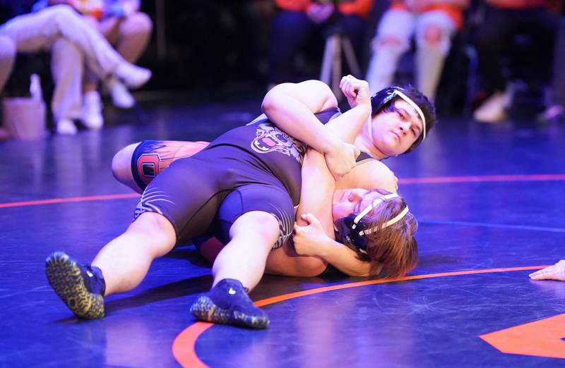 Oswego East’s Josh Edwards pins Oswego Easts’s Jack Farrell in a 215 pound match during a wrestling meet at Oswego High School in Oswego on Thursday, Jan 11, 2024.