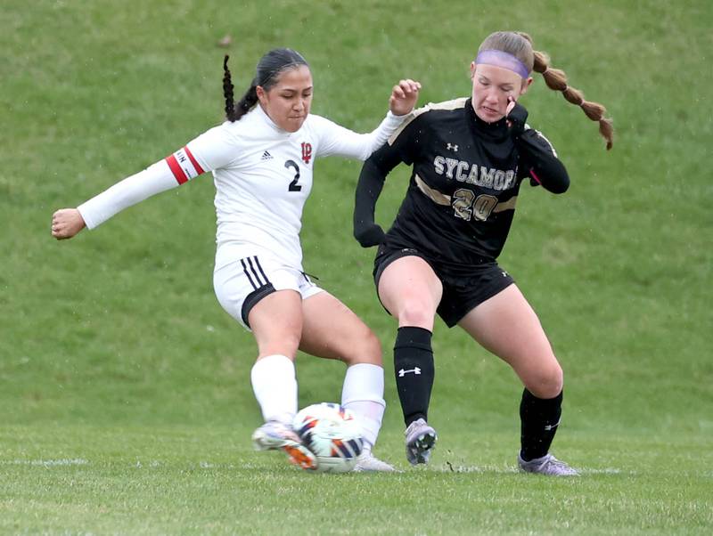 La Salle-Peru's Vicky Tejada and Sycamore's Cortni Kruizenga battle for possession during their game Wednesday, April 9, 2025, at Sycamore High School.