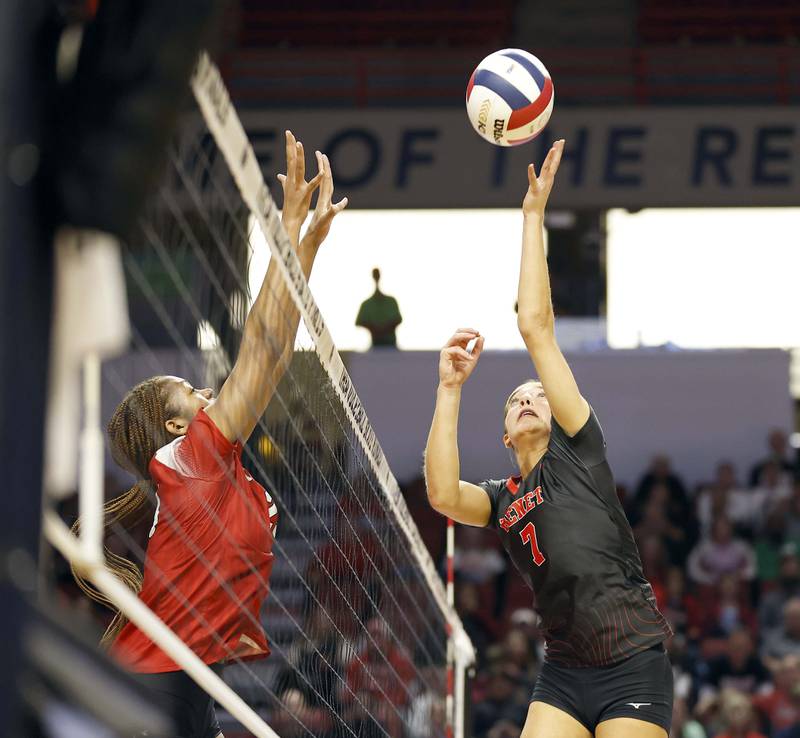 Benet Academy's Audrey Asleson (7) pushes the ball over the net during the IHSA Class 4A girls volleyball championship match Saturday, Nov. 16, 2024 at CEFCU Arena in Normal.