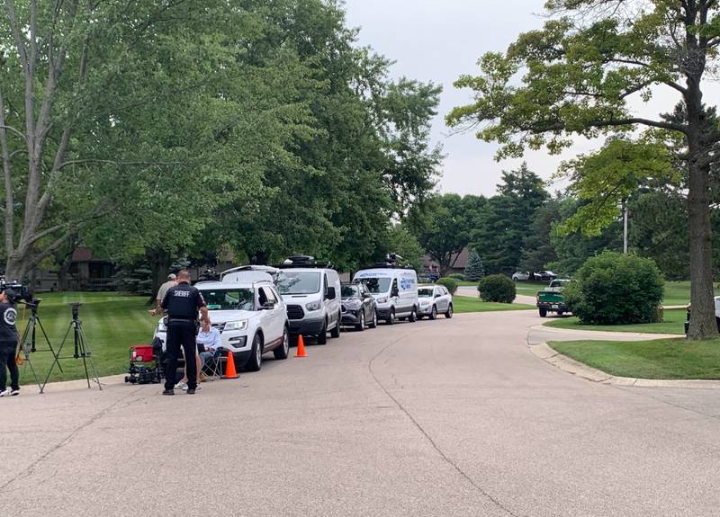 Law enforcement and media outlets gather Wednesday, Aug. 9, 2023, at Wild Plum and White Ash roads near Crystal Lake where the McHenry County Sheriff's Office said four people were shot and it was conducting a death investigation.