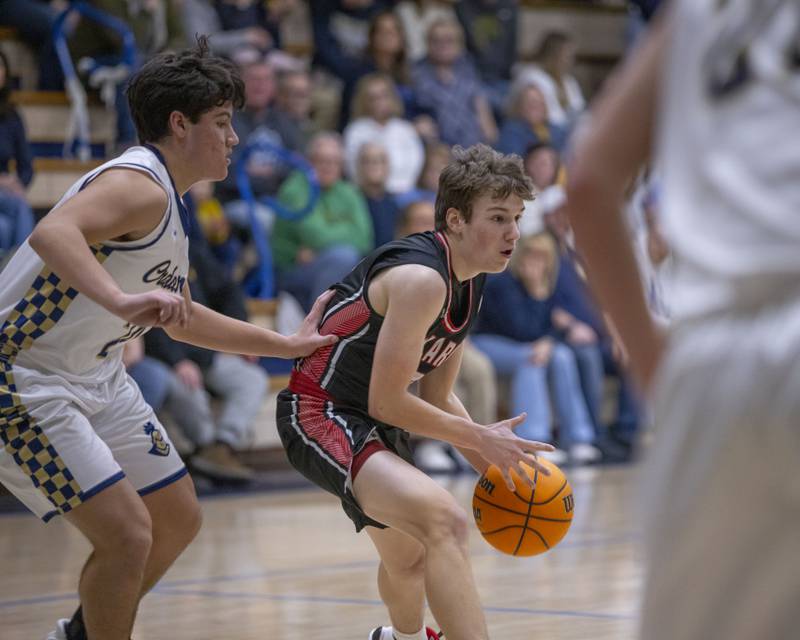 Ben Meachum of Henry-Senachwine looks for a teammate to pass to during the game against Marquette on February 7, 2025.