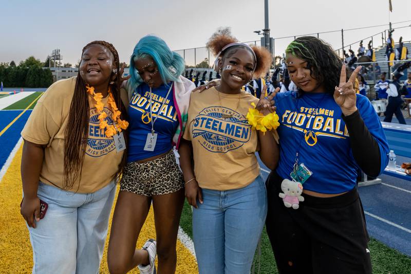 Joliet Central’s varsity football team managers stand on the sidelines before a home football game against Plainfield Central on Sept. 26, 2025.