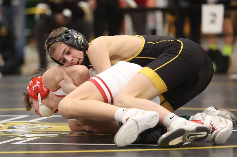 Nicholas Murdock-Schey of Joliet West works over Ramsey Barton of Yorkville in the 106-pound weight SPC Conference championship match at Joliet West on Saturday, Jan 25, 2025.