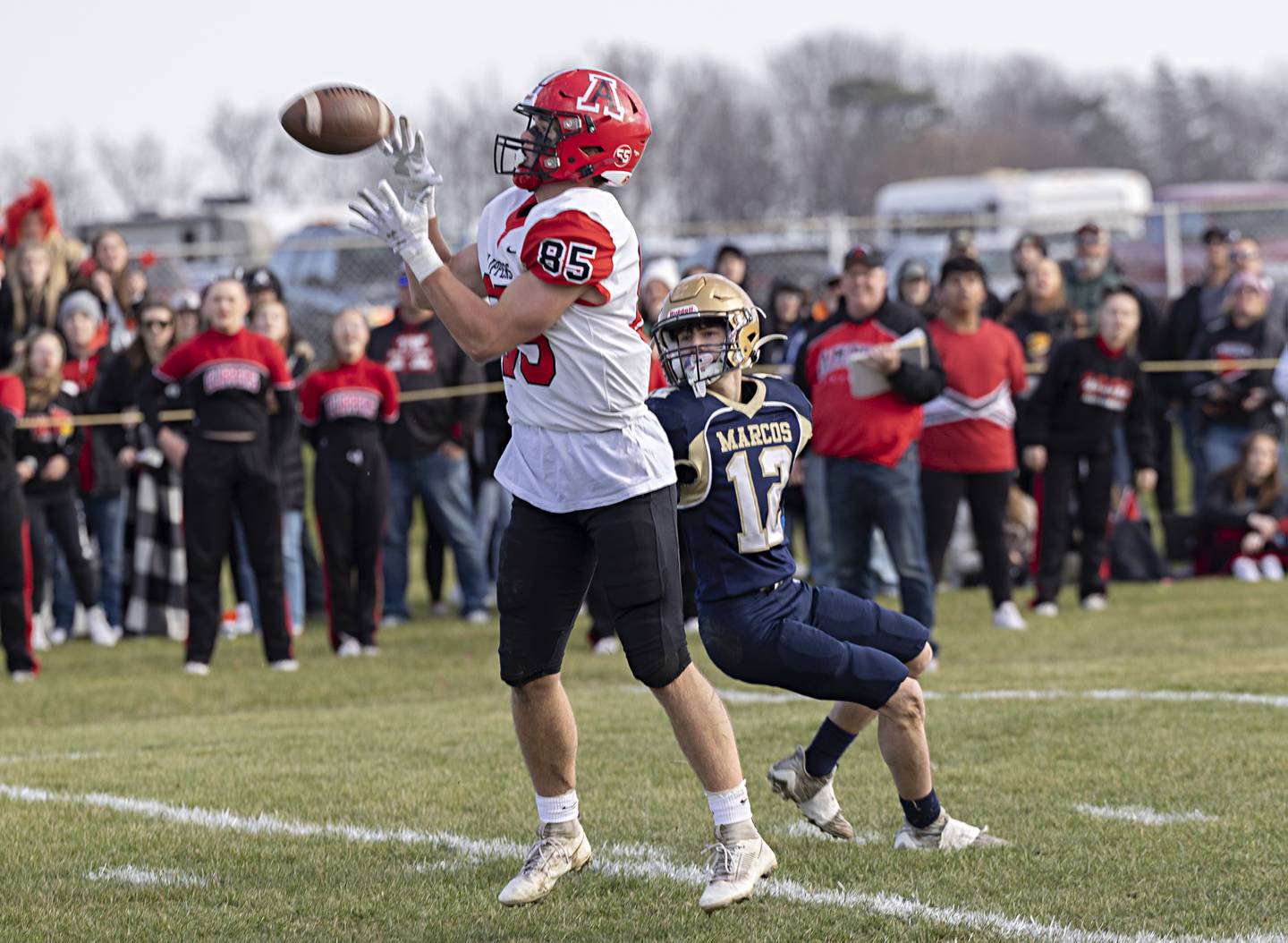 Amboy’s Brennan Blaine hauls in a pass against Polo’s Billy Lowry Saturday, Nov. 11, 2023 during a semifinal 8-man football game in Polo.