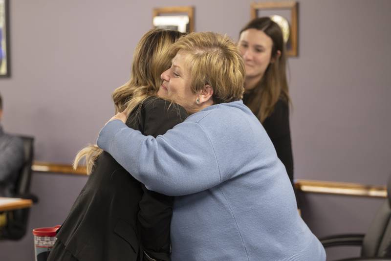 Retiring Dixon Superintendent Margo Empen (right) hugs incoming superintendent Melydi Huyett on Wednesday, Dec. 17, 2025.