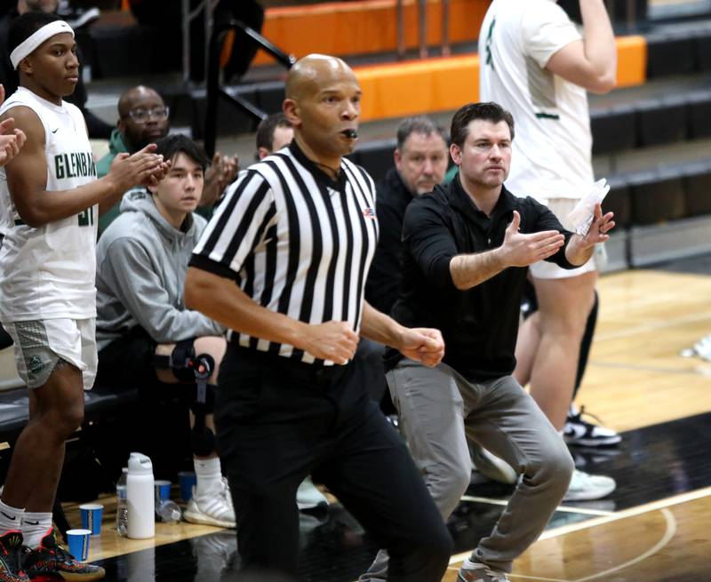 Glenbard West's head coach Jason Opoka signals during a Class 4A St. Charles East Sectional semifinal against Glenbard East on Tuesday, March 4, 2025 in St. Charles.