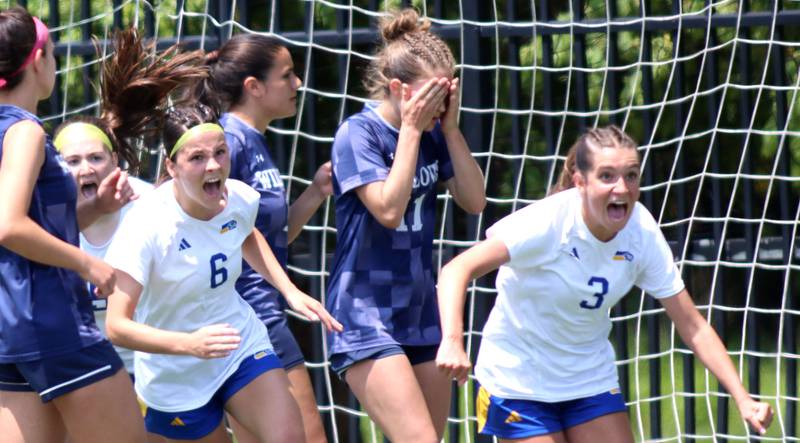 Johnsburg’s Liz Smith and Charlie Eastland rush to greet Devynn Michel  after her goal tied the score in OT against Willows Academy in IHSA Class 1A Supersectional soccer action at Dominican University in River Forest on Saturday, May 31, 2025.