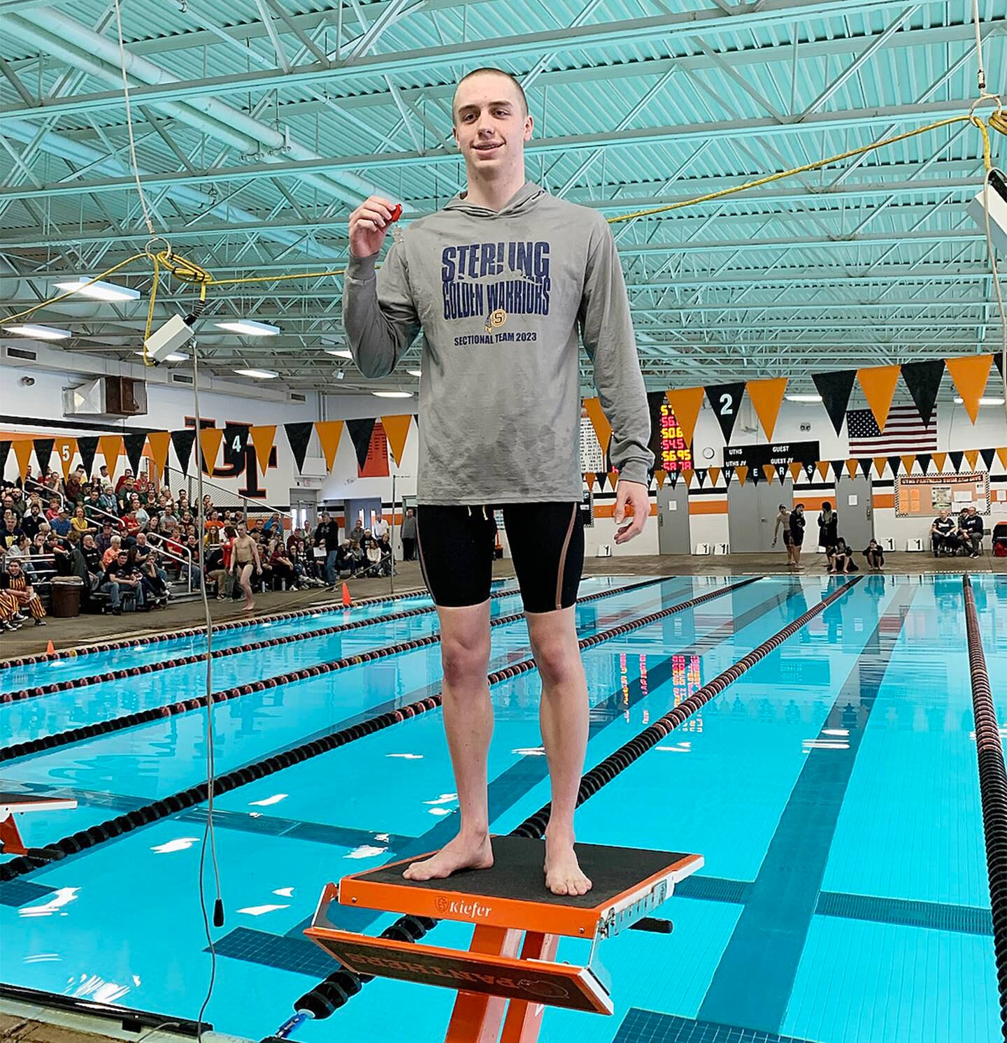 Sterling swimmer Skylar Drolema poses with his second-place medal after swimming the 50-yard freestyle at the United Township Sectional on Saturday, Feb. 18, 2023 in East Moline. Drolema qualified for state in the event.