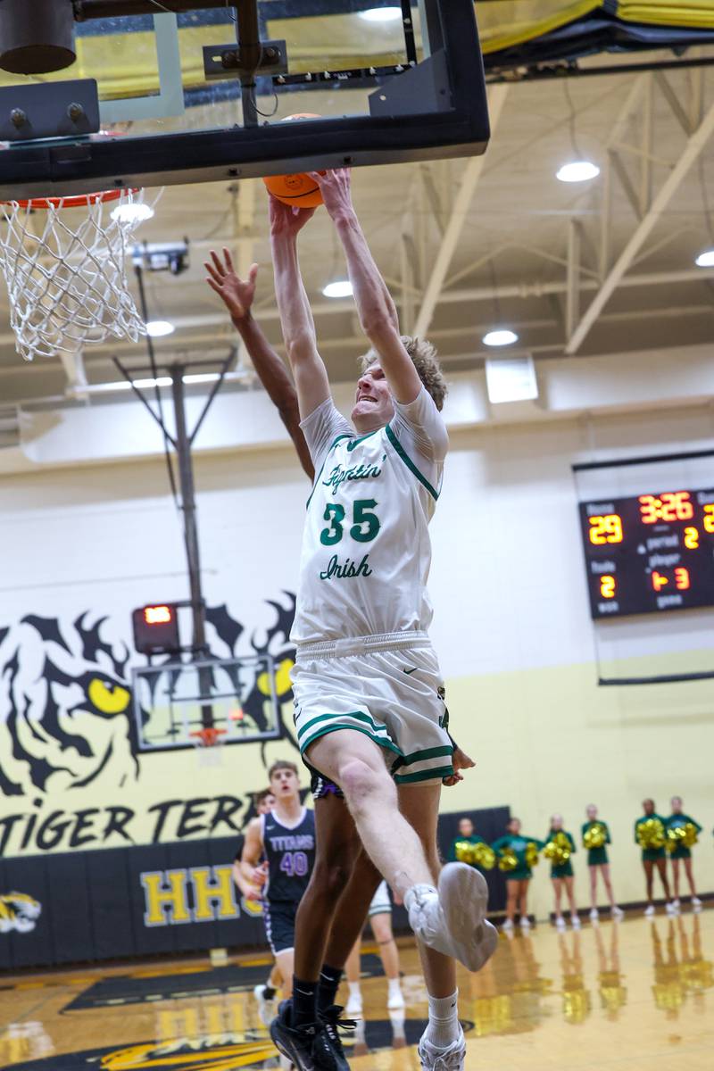Bishop McNamara's Richard Darr approaches for a dunk during the Fightin' Irish's 66-52 victory over El Paso-Gridley in the IHSA Class 2A Herscher Regional championship on Friday, Feb. 27, 2026.