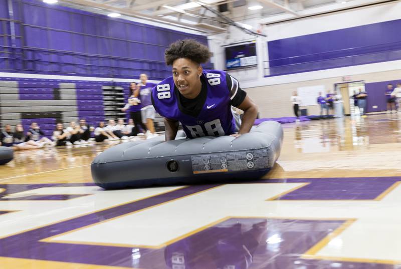 Dixon’s Devon Wallace skids across the finish line to take the win for the senior class Friday, Sept. 27, 2024, at Dixon High School.