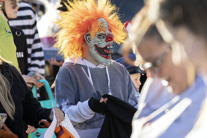 Elijah Ward, 11, creeps out the crowd with his clown mask Wednesday, Oct. 26, 2022 at SPD’s trunk or treat.