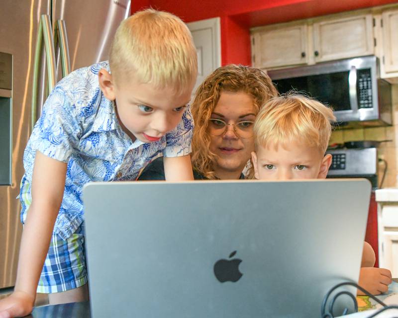 Brooke Christenson teaches her sons Malcom, 5, and Maverick, 3, about continents through songs she has found on the internet on Friday Oct. 3, 2025, while being home schooled in St Charles Township.