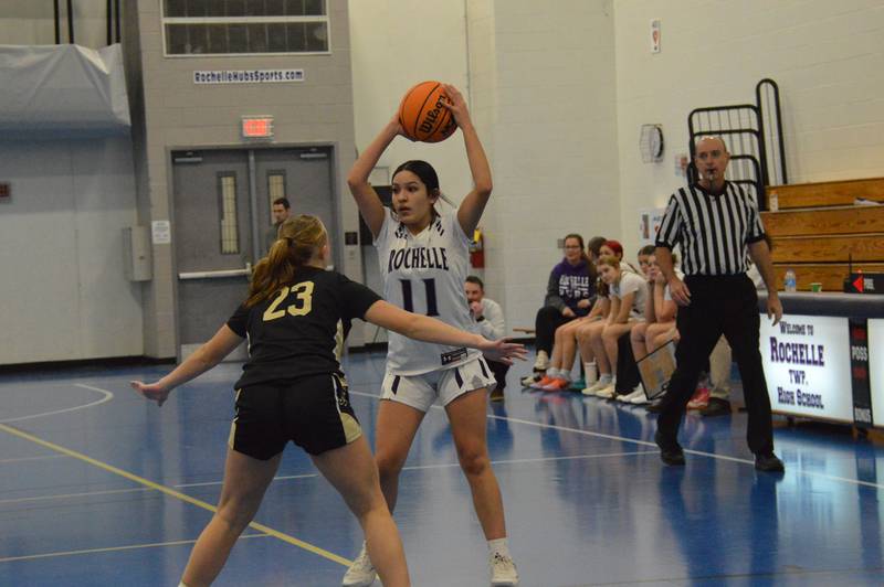 Rochelle's Evelyn Garcia looks for a teammate during a JV basketball game.