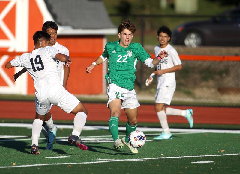 York’s Jayden Waski (22) goes after the ball in the first half of their Class 3A St. Charles East Sectional semifinal game against Addison Trail on Wednesday, Oct. 26, 2022.