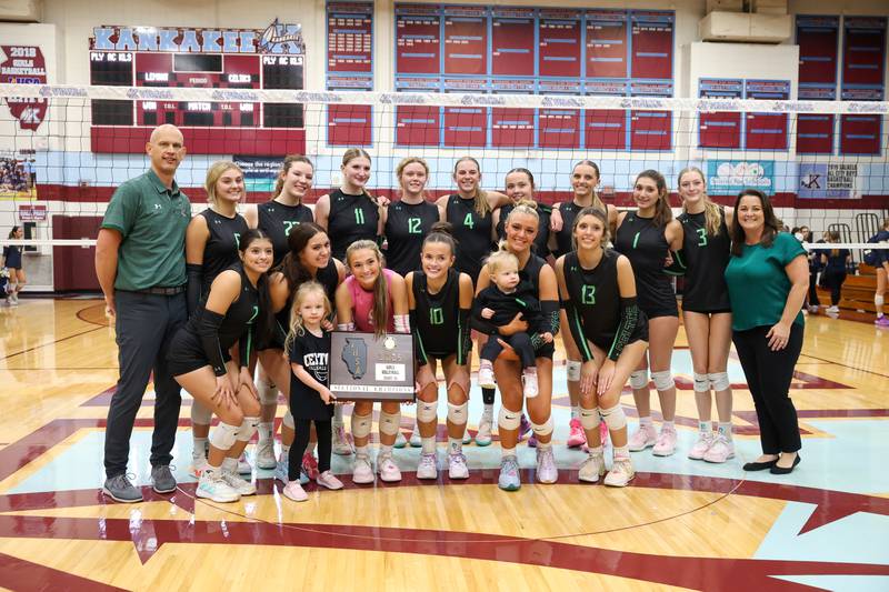 Providence players and coaches pose with the IHSA Class 3A Kankakee Sectional championship following the Celtics' victory in two sets, 25-25, 25-18, over Lemont in the on Thursday, Nov. 6, 2025.