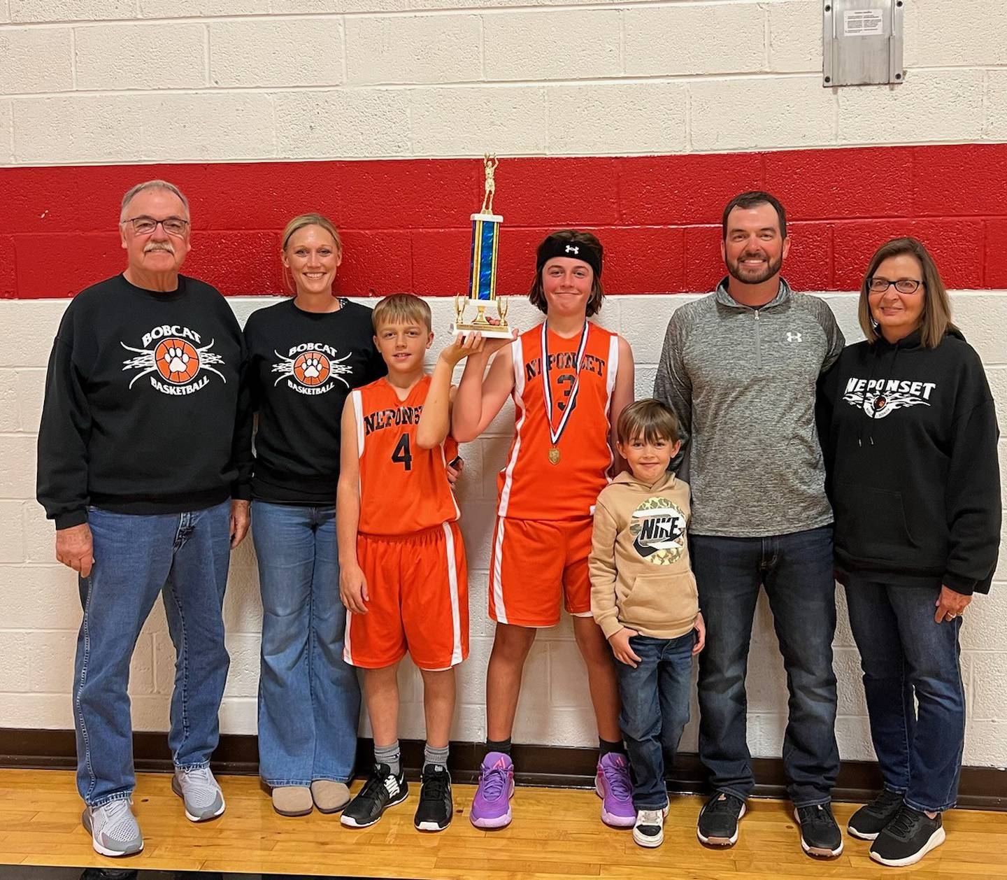 There have been three generations of the Blake family involved in Neponset Bobcats basketball. Picture are past Coach Tom Blake (from left), Chelsea Blake (mom), Jase Blake, Easton Blake, Colt Blake (coach/manager), Coach John Blake, and Crystal Blake (grandma).