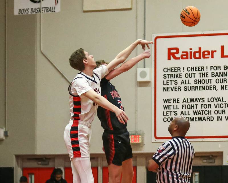 Benet's Colin Stack (42) tips off against Yorkville's Joey Jakstys (32) during their Class 4A Bolingbrook Sectional semifinal basketball game between Yorkville at Benet, March 3, 2026 in Bolingbrook.