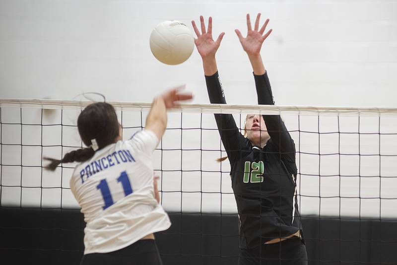 Rock Falls’ Emily Lego goes up to block a shot against Princeton’s Olivia Gartin Saturday, Sept. 3, 2022 at the Rock Falls Volleyball Invitational.