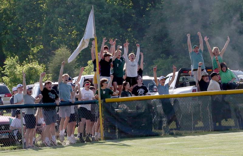 St. Bede fans react after Ella Hermes smacks a three-run home run against Biggsville in the Class 3A Sectional championship game on Friday, May 26, 2023 at St. Bede Academy.