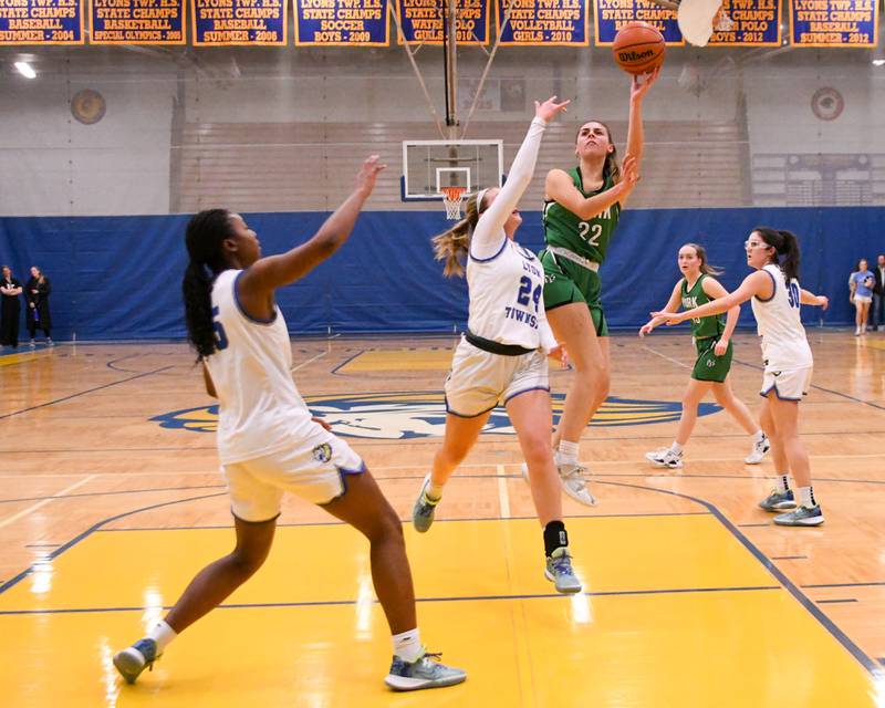 York Stella Kohl (22) takes a shot over Lyons Township defenders during the first quarter on Friday Feb. 3rd while traveling to Lyons Township High School.