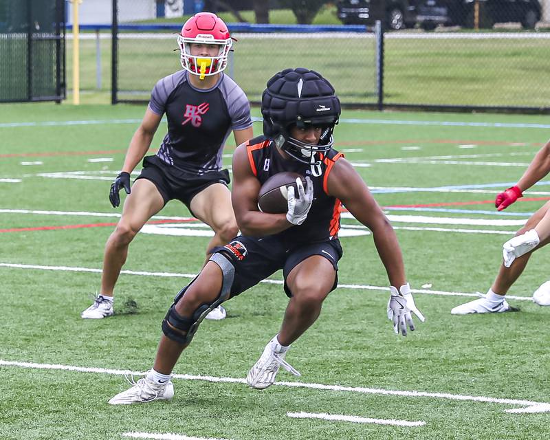 Minooka's Jaxon Banner makes a move after a short reception during the Downers Grove South 7 on 7 football tournament, July 12, 2025  in Downers Grove.