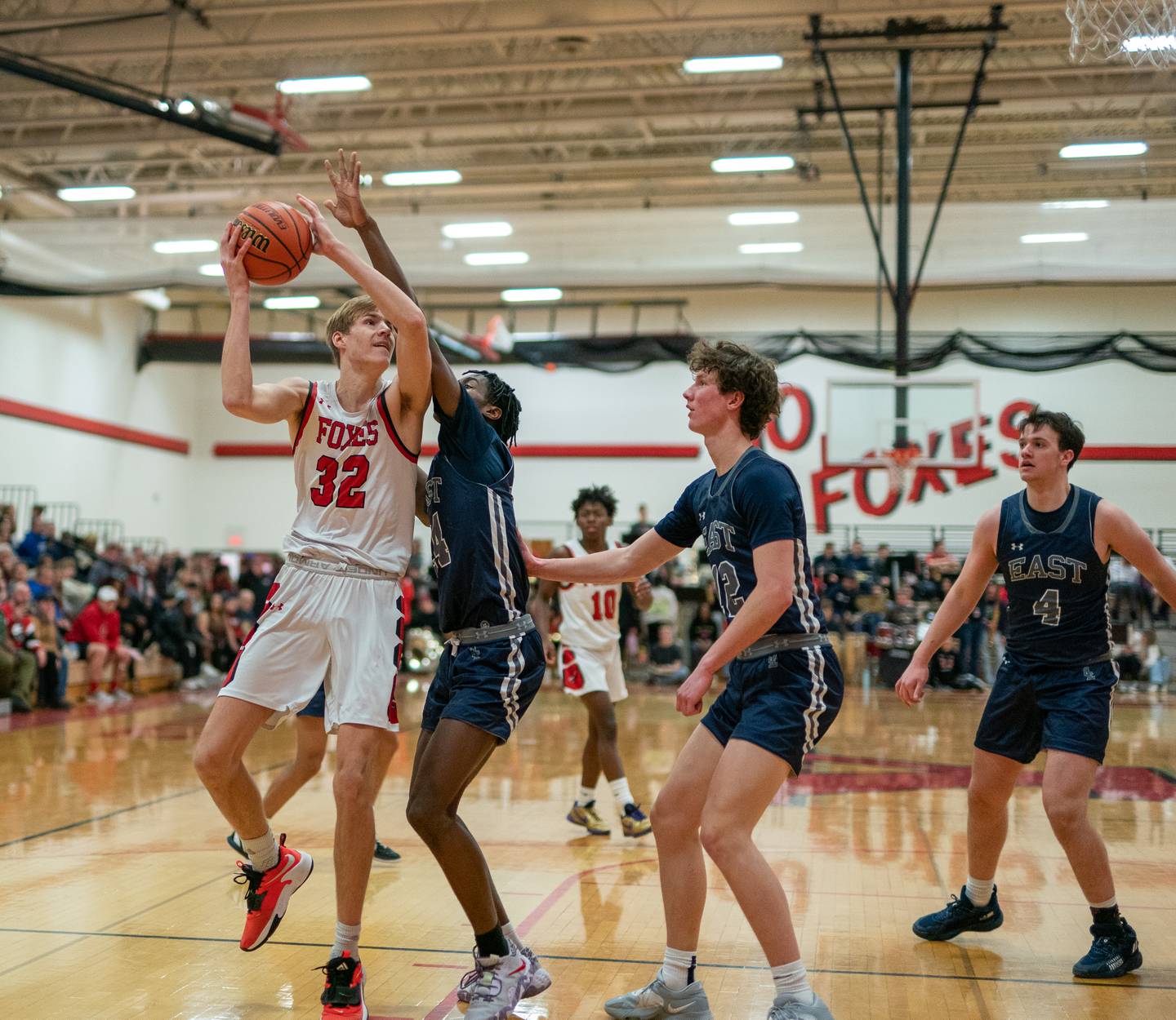 Yorkville's Jason Jakstys (32) shoots the ball in the post against Oswego East's Mekhi Lowery (24) during a basketball game at Yorkville High School on Friday, Feb 3, 2023.