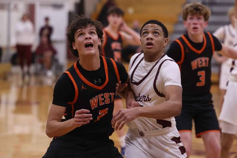 Lincoln-Way West’s John Schwerha and Lockport’s Gavin Anderson battle for position under the basket on Friday, Dec. 6, 2024 in Lockport.