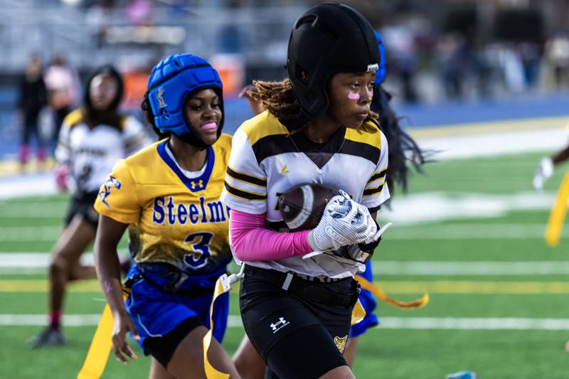 Joliet West's Tamia Saunders scores an extra point during a varsity flag football game against Joliet Central at Joliet Central on Oct. 2, 2025.