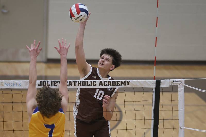 Joliet Catholic’s Joseph Egizio gets up for a shot against Joliet Central on Wednesday, April 1, 2026 in Joliet.