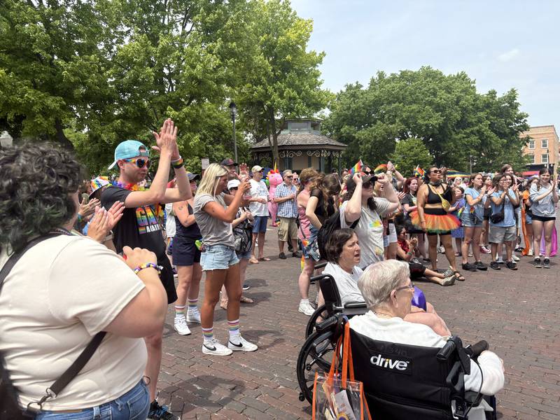 Attendees clap during Woodstock PrideFest June 15, 2025.