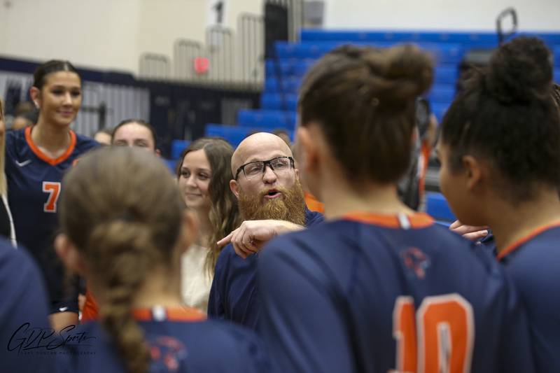 Oswego head coach Gary Mosley addresses the team after winning their Class 4A Regional Final volleyball match against Neuqua Valley. Oct 30, 2025 in Plainfield.