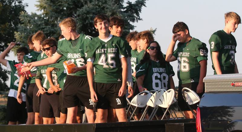 Members of the St. Bede football team ride in the St. Bede Homecoming Parade on Friday, Sept. 29, 2023 at St. Bede Lane.