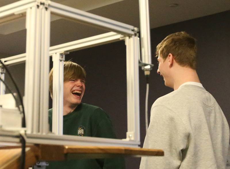 St. Bede Academy students Greyson Marincic and Garrett Connelly react while racing their car during the 18th annual Editable Car Contest on Wednesday, Feb. 28, 2024 at Illinois Valley Community College in Oglesby.