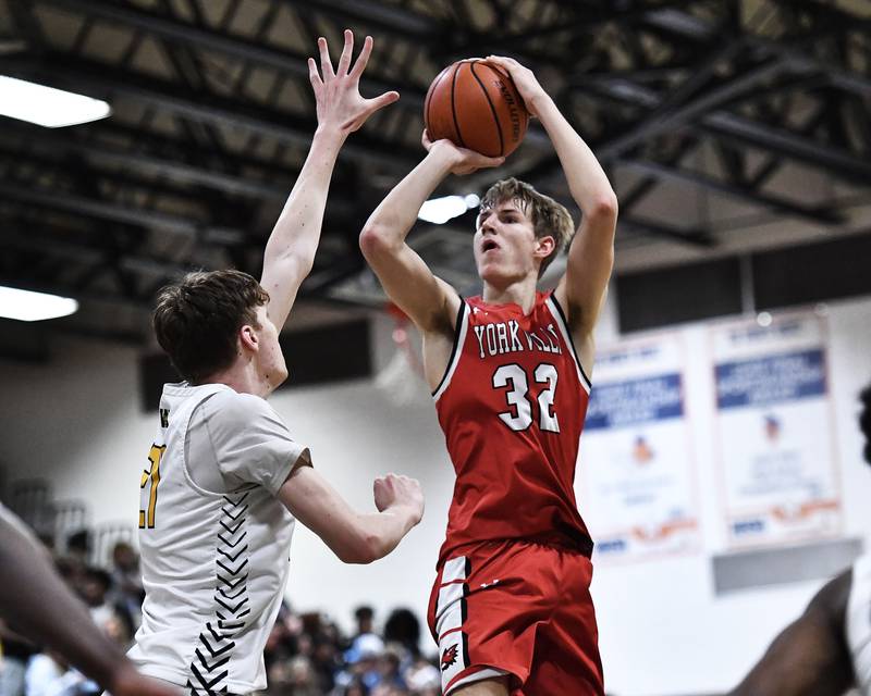 Yorkville's Jason Jakstys shoots a jump shot over Joliet West defender on Friday, Jan. 20, 2023, at Joliet.