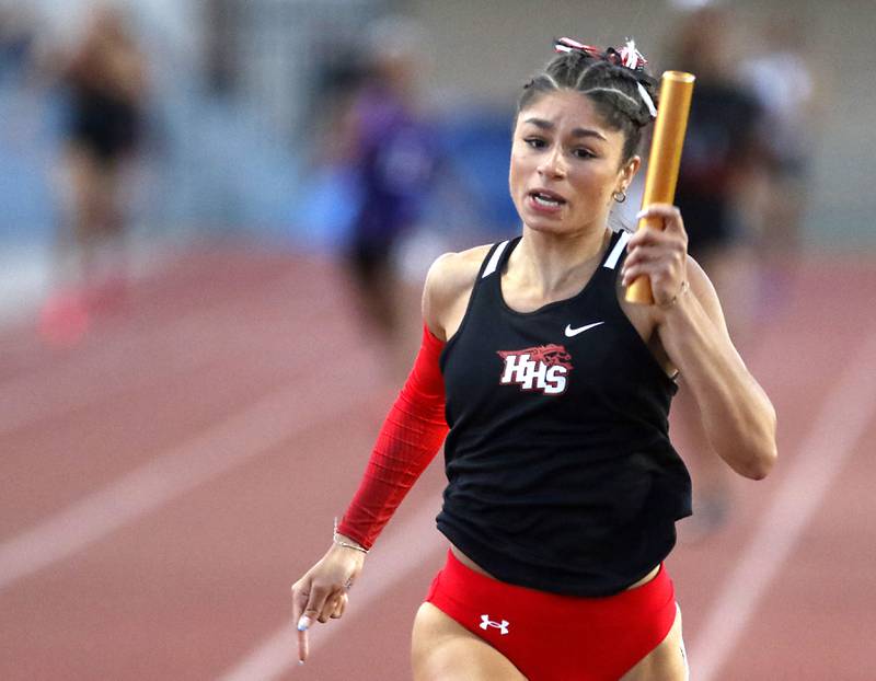 Huntley’s Victoria Evtimov sprints to the finish line as she runs the final leg of the 4 x 200 meter relay during the Huntley IHSA Class 3A Girls Sectional Track and Field Meet on Wednesday, May 8, 2024, at Huntley High School.