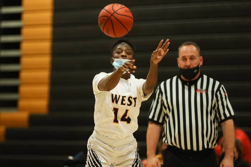 Joliet West’s Destiny McNair passes against Joliet Central. Tuesday, Feb. 8, 2022, in Joliet.