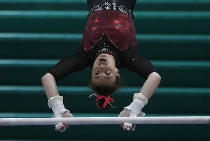 Prairie Ridge’s Gabriella Riley competes in uneven parallel bars Wednesday, Feb. 8, 2023, during  the IHSA Stevenson Gymnastics Sectional at Stevenson High School in Lincolnshire.